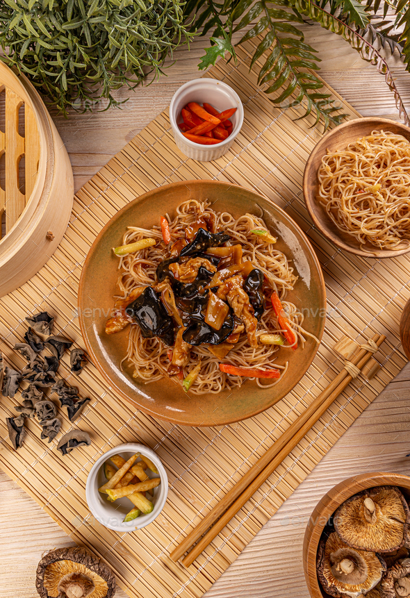 Noodles stir fry with ear wood mushrooms Stock Photo by grafvision